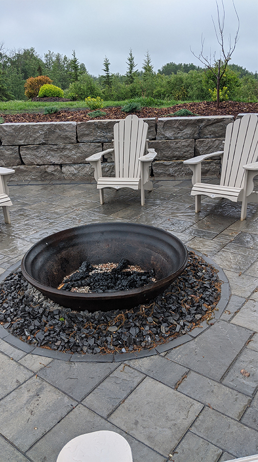 Metal Fire Feature Set Into Stone Patio
