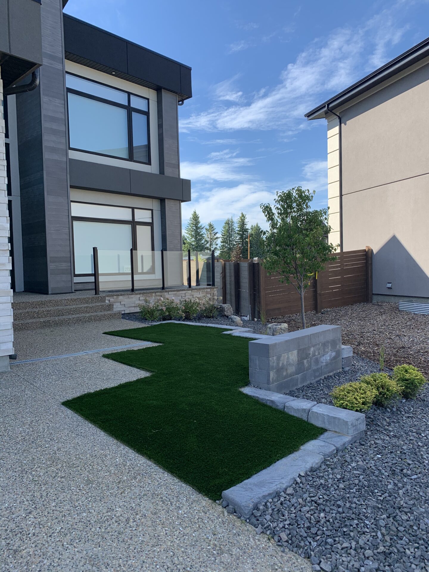 Stone and grass backyard landscaping ideas